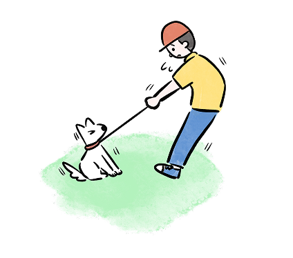 嫌がる犬の紐を引っ張る飼い主
